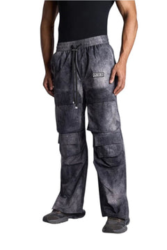 My Store AMIRI cargo pants in a grey acid-wash finish with a drawstring waist and side pockets worn by a model