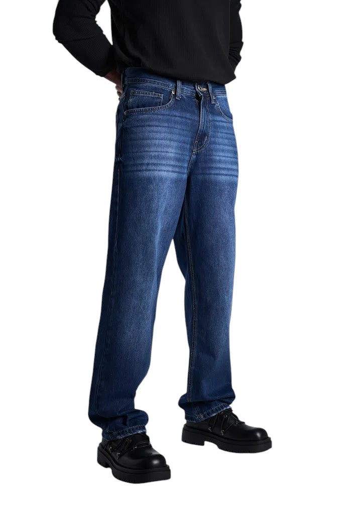 My Store baggy fit dark blue denim jeans worn by a model with black long-sleeved shirt and chunky black shoes