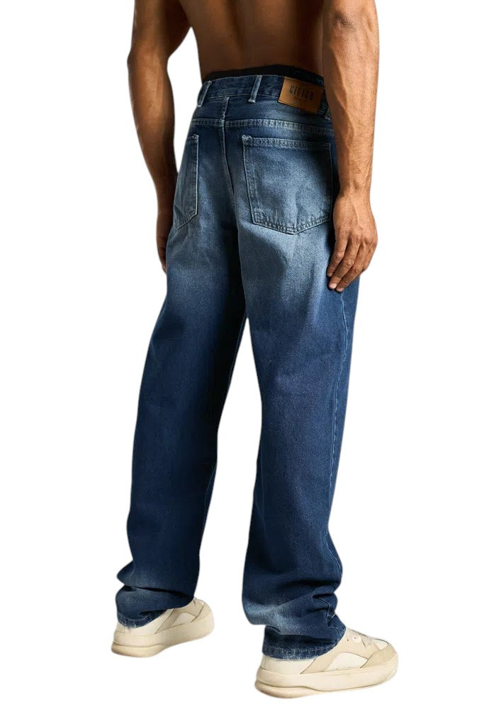 My Store baggy fit dark blue denim jeans worn by a shirtless man, back view showing pockets and leather patch