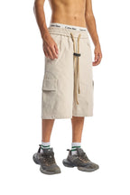 My Store beige cargo shorts with elastic waistband and drawstring, worn by a model with sneakers
