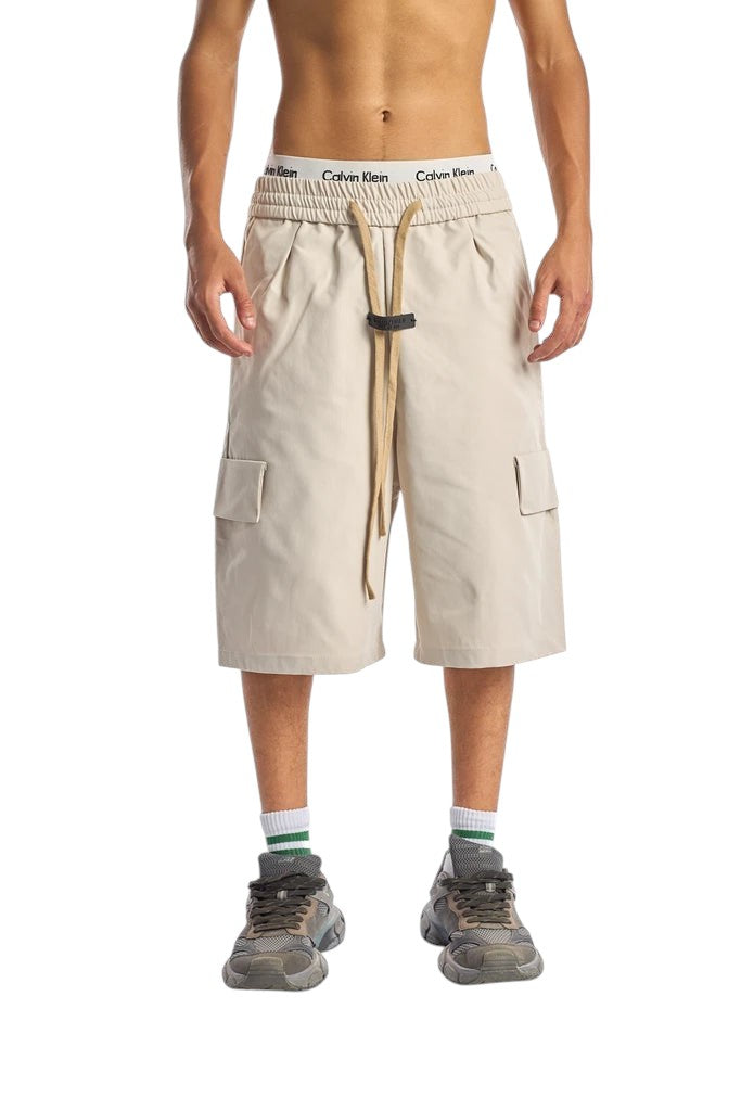 My Store beige cargo shorts with elastic drawstring waistband and side pockets worn by a model