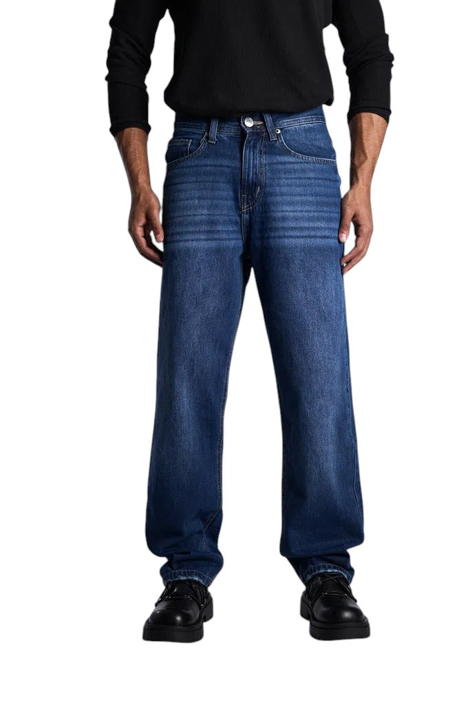 My Store dark blue baggy fit denim jeans worn by a model with a black long-sleeve shirt and black shoes