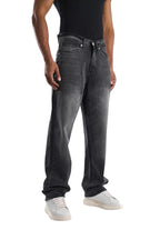 My Store dark gray washed baggy fit jeans with an ultra-wide leg silhouette worn by a model with white sneakers