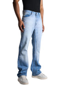 My Store light blue washed flared denim jeans worn by a model with white sneakers