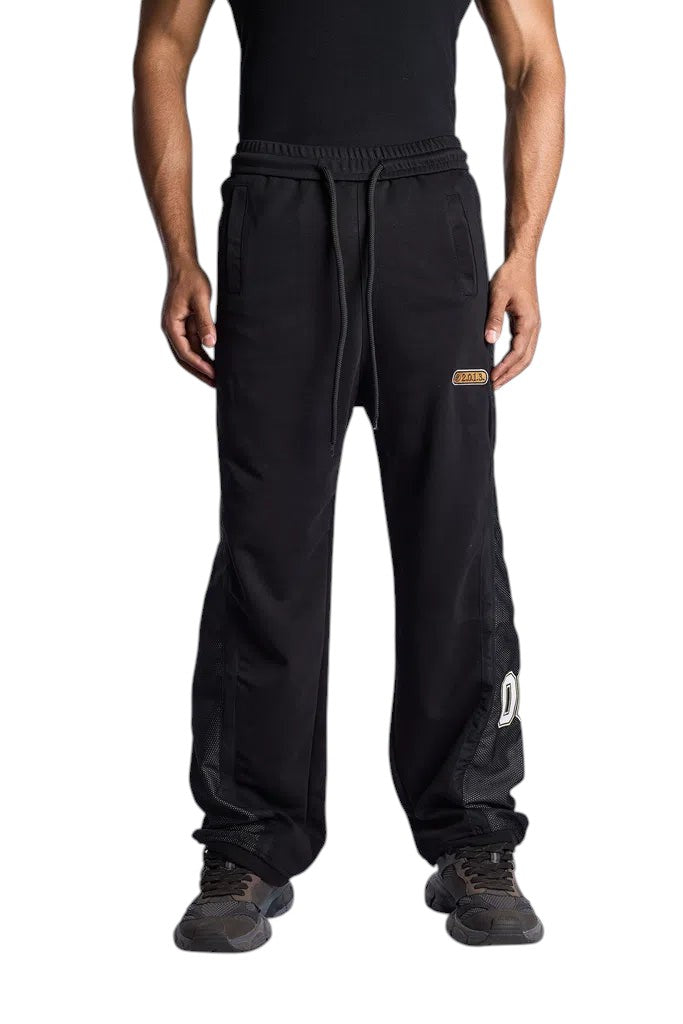 My Store Off-White black sweatpants with mesh side panels and drawstring waist worn by a model