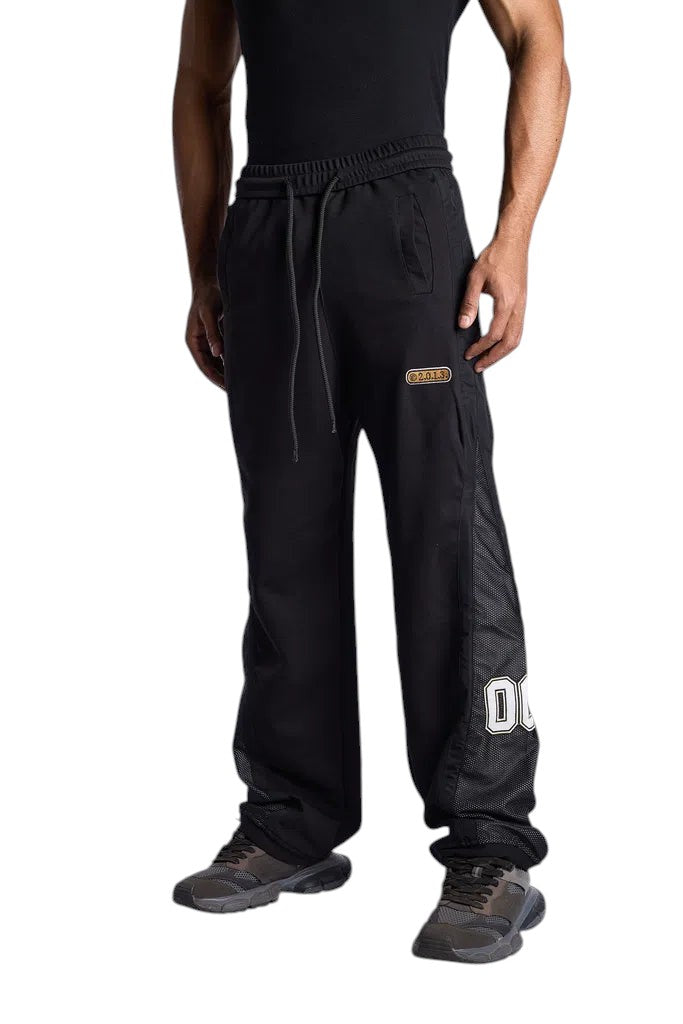 My Store Off-White black sweatpants with mesh side panels and white logo detail worn by a model