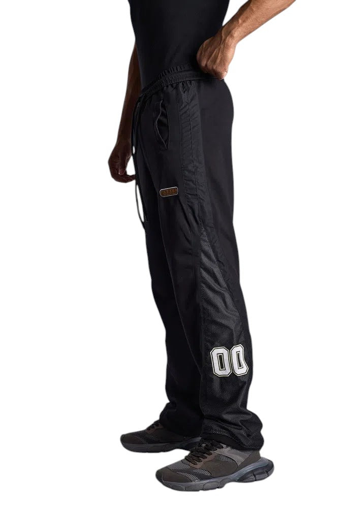 My Store Off-White black sweatpants featuring mesh side panels and number 00 detail, worn by a model