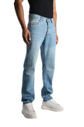 My Store relaxed fit jeans in a light sky blue washed denim worn by a man with white sneakers