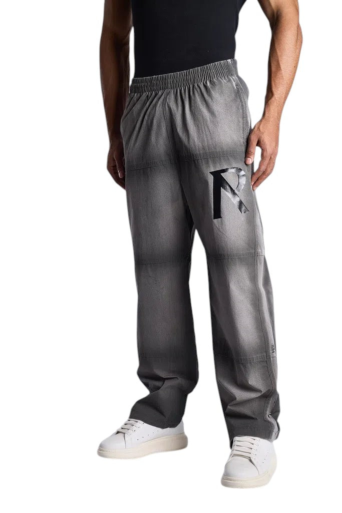 My Store Represent sweatpants in a grey gradient wash with a black R logo on the leg worn by a male model