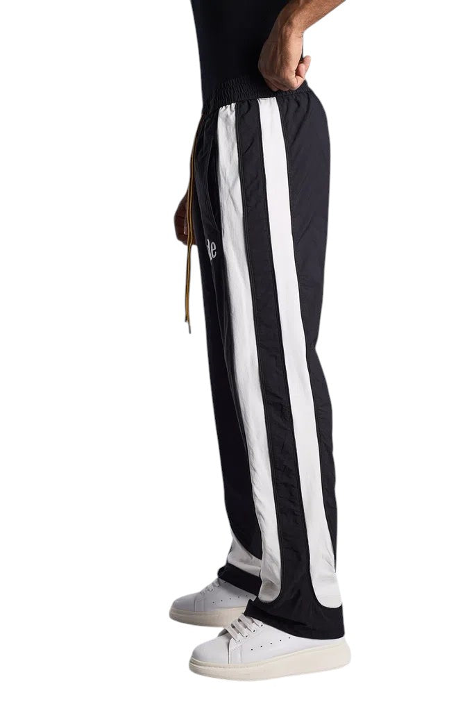 My Store Rhude black and off-white ski track pants with side stripes and drawstring waist, side view