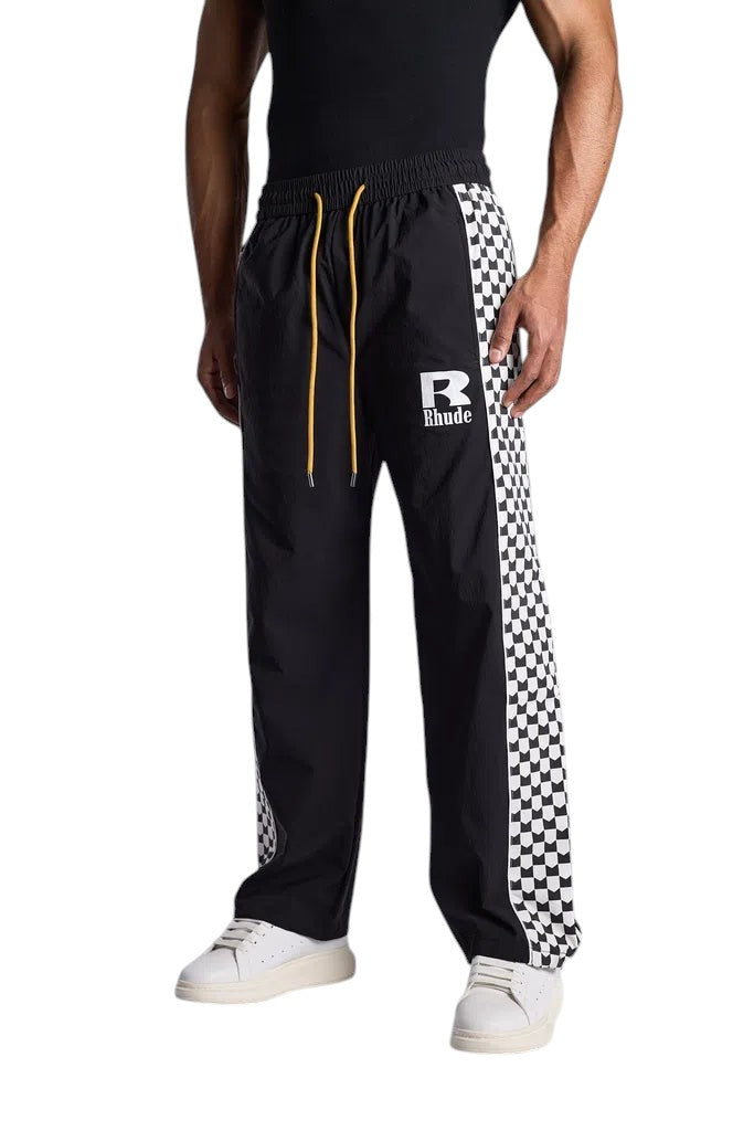 My Store Rhude track pants in black with a white and black checkered side stripe and yellow drawstring waist