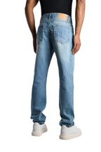 My Store relaxed fit jeans in sky blue washed denim worn by a man from the back view with white sneakers