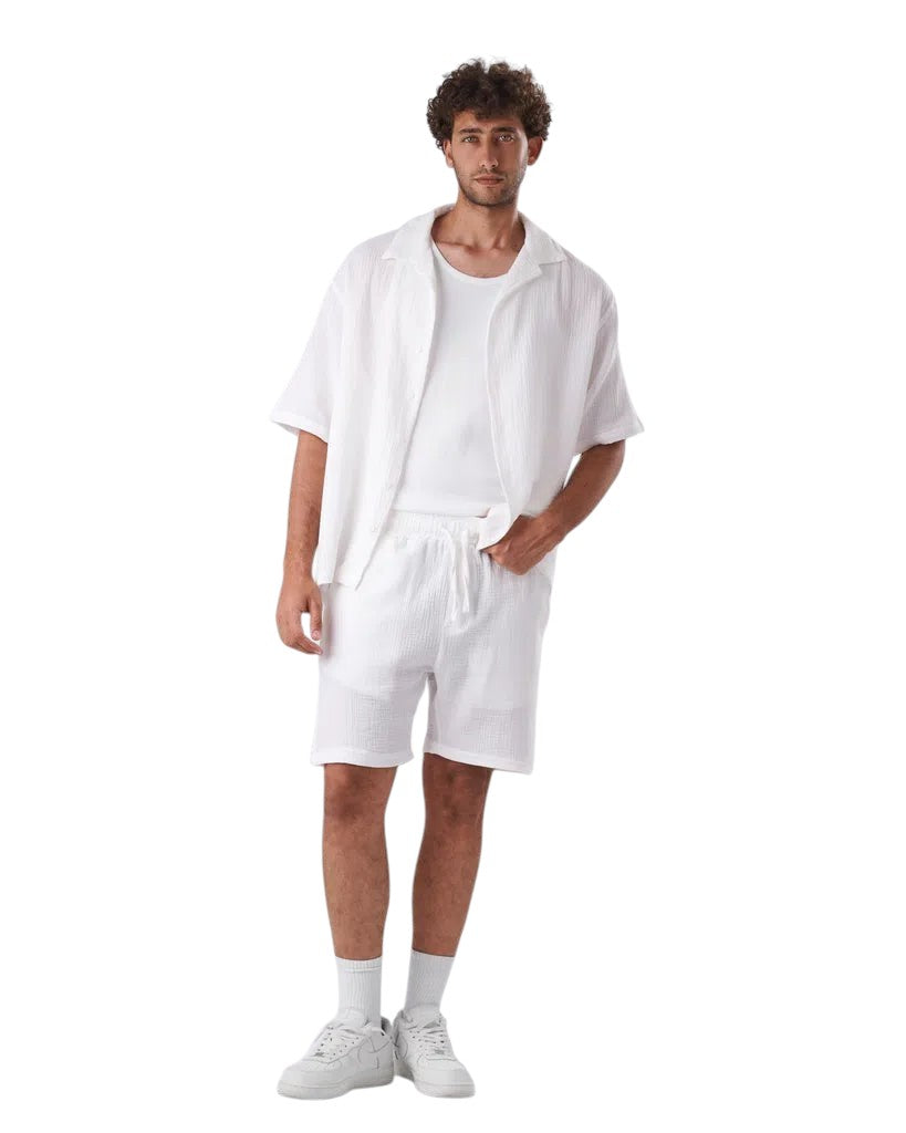 My Store white linen short set featuring a textured button-down shirt and matching shorts worn by a male model.