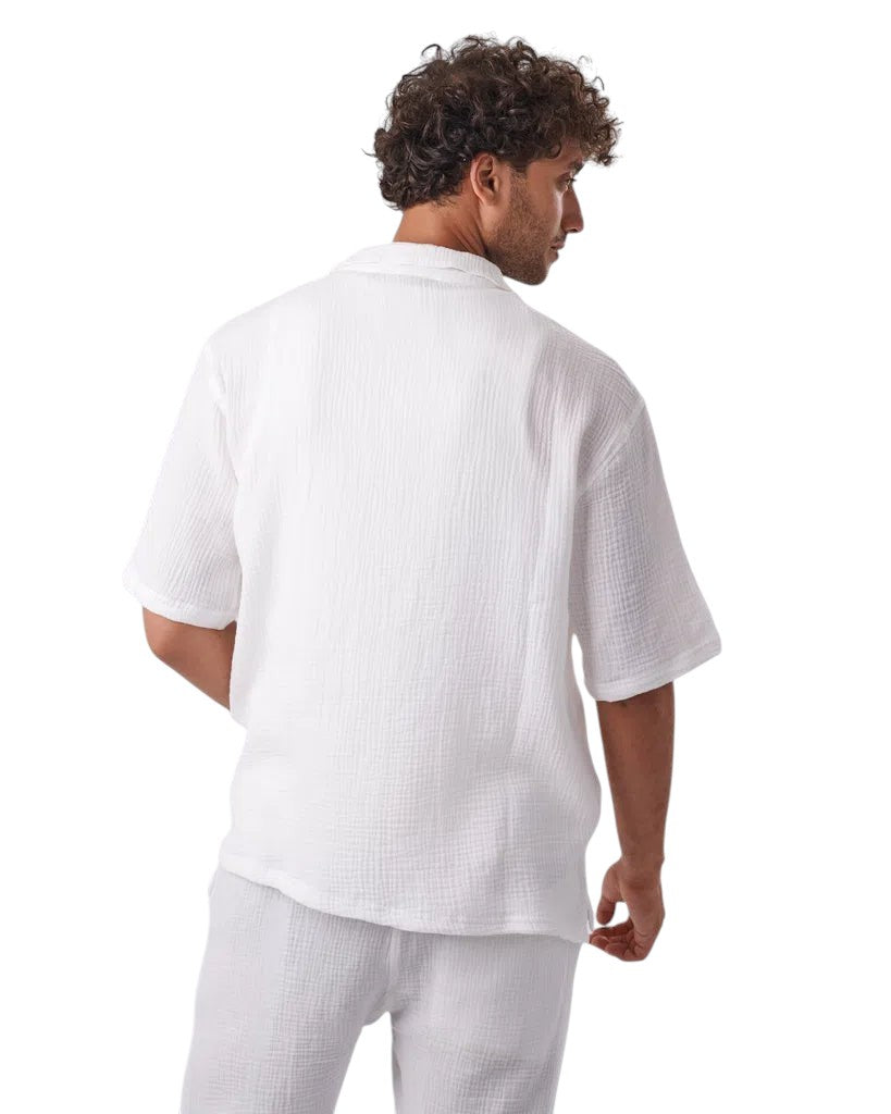 My Store white linen short set worn by a man, showing the back view of the textured short-sleeve button-up shirt.