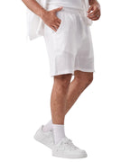 My Store white linen shorts with an elastic waistband worn by a man with white sneakers